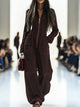 Women's wide-leg jumpsuit with stand collar and front zip, shown in burgundy and pink