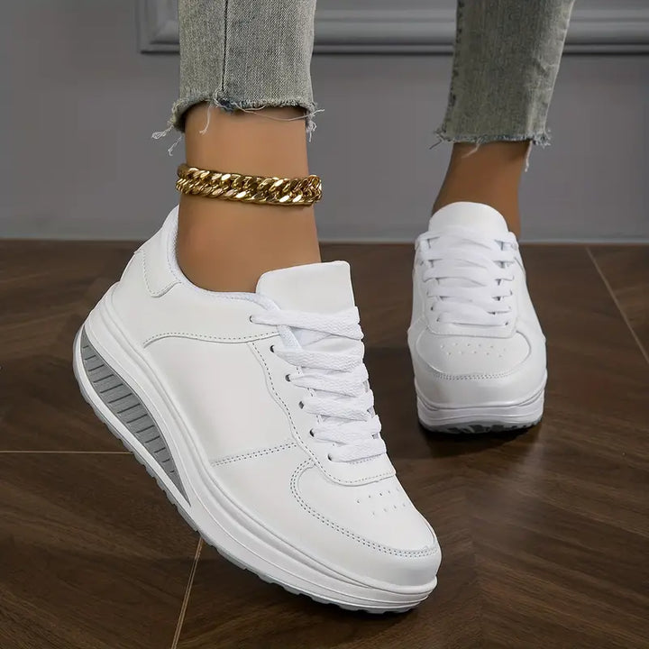 Women's low-top lace-up sneakers with printed uppers and raised soles