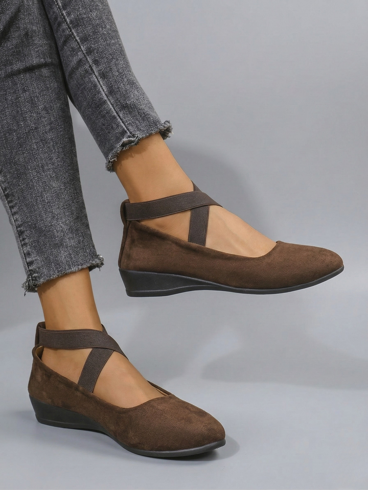 Women's black and beige closed-toe platform wedge shoes with elastic ankle strap
