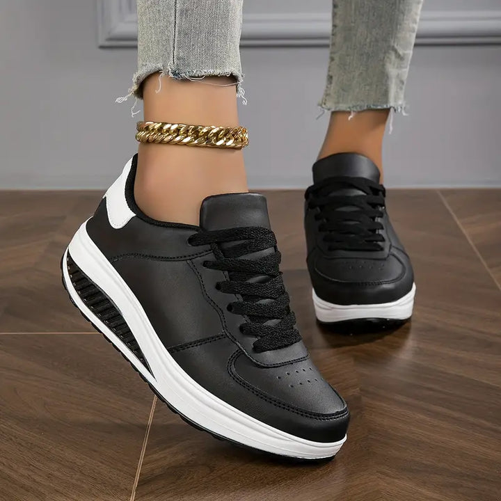 Women's low-top lace-up sneakers with printed uppers and raised soles