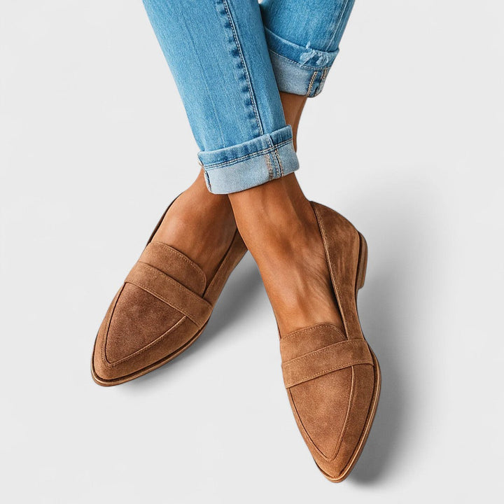 Women's pointed toe loafers with penny strap detail