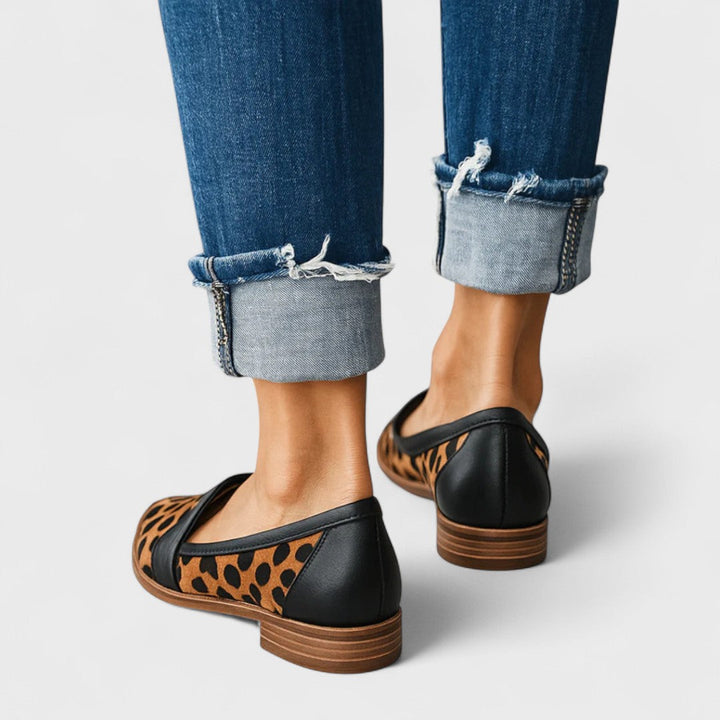Women's pointed toe loafers with penny strap detail
