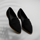 Pair of pointed-toe suede loafers with a penny saddle strap and a low heel