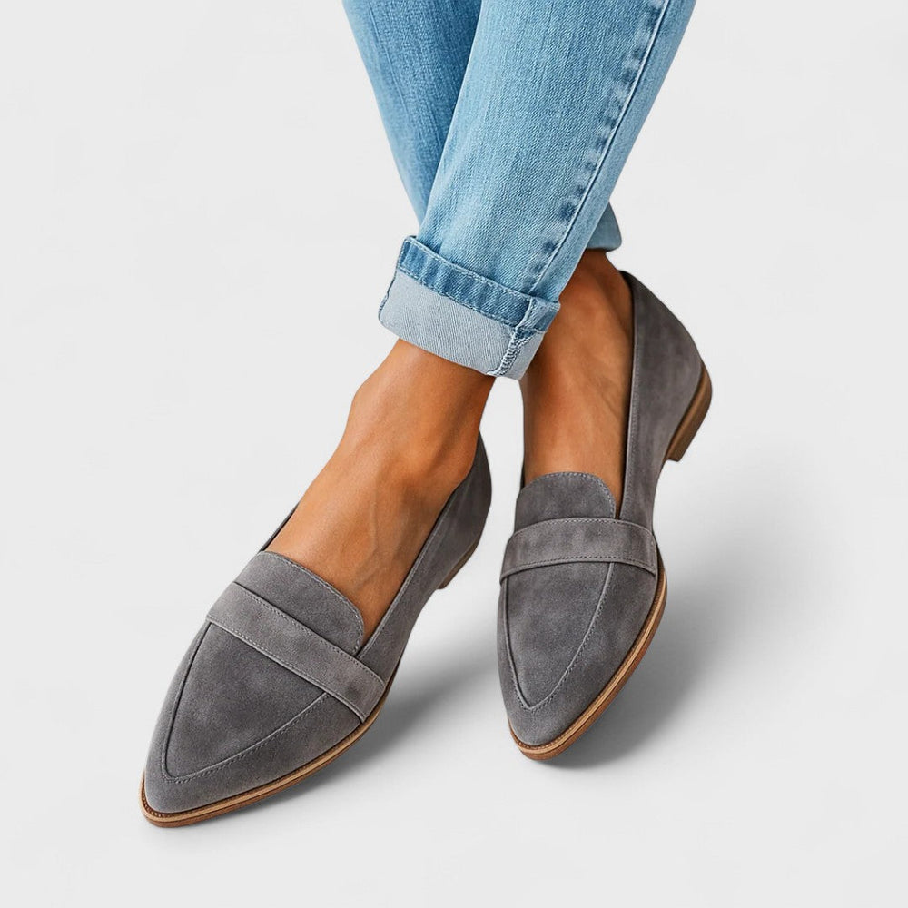 Women's pointed toe loafers with penny strap detail