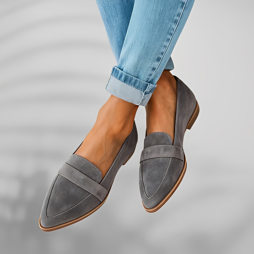 Pair of pointed-toe suede loafers with a penny saddle strap and a low heel