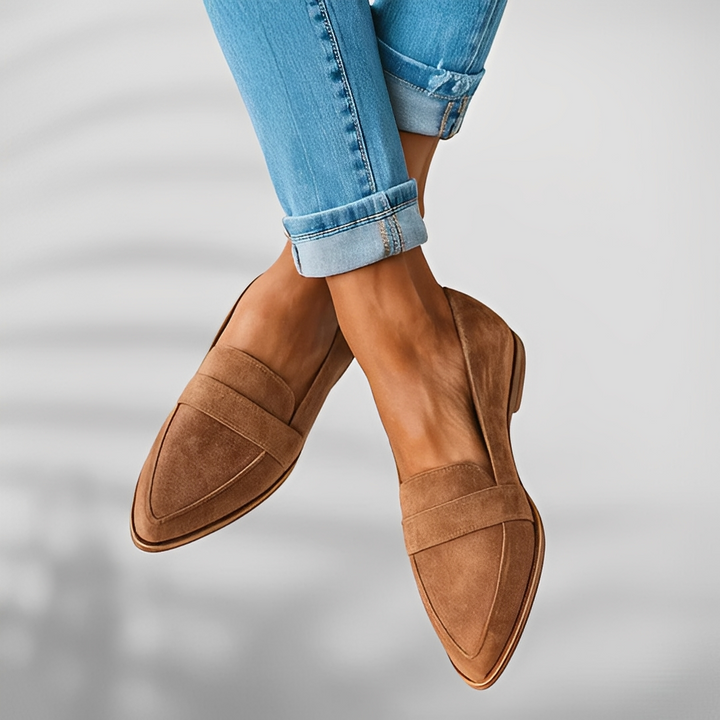 Pair of pointed-toe suede loafers with a penny saddle strap and a low heel