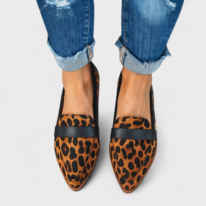 Women's pointed toe loafers with penny strap detail