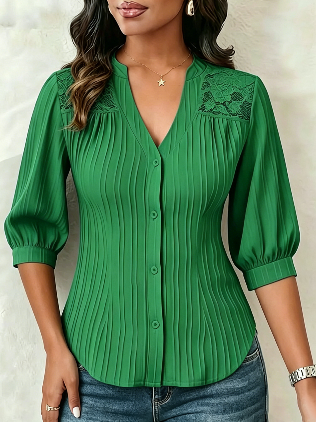 V-neck blouse with vertical pleats, lace shoulder panels, and puffed three-quarter sleeves