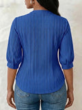 V-neck blouse with vertical pleats, lace shoulder panels, and puffed three-quarter sleeves