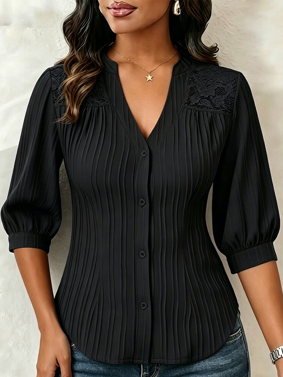 V-neck blouse with vertical pleats, lace shoulder panels, and puffed three-quarter sleeves