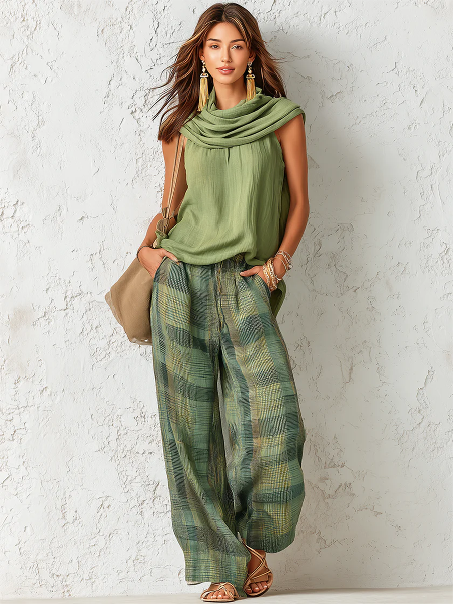 Women's sage green cowl neck top with green and gold checkered wide-leg trousers