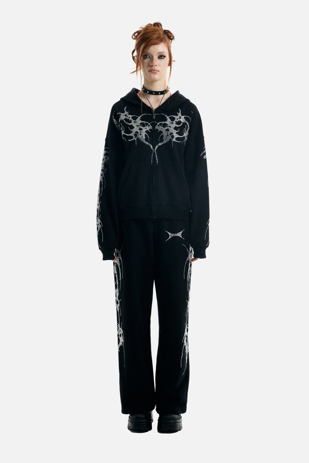 Women's black zip-up hoodie with rhinestone wing and thorn graphics