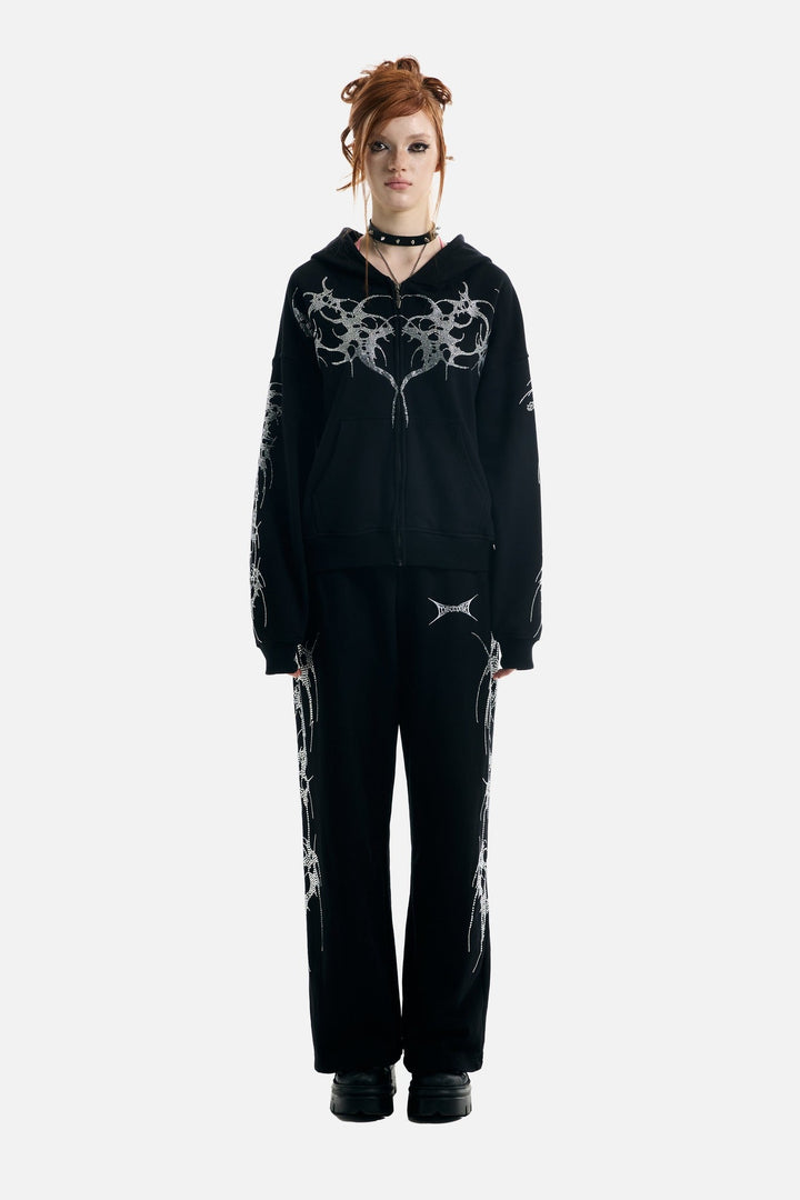 Women's black zip-up hoodie with rhinestone wing and thorn graphics