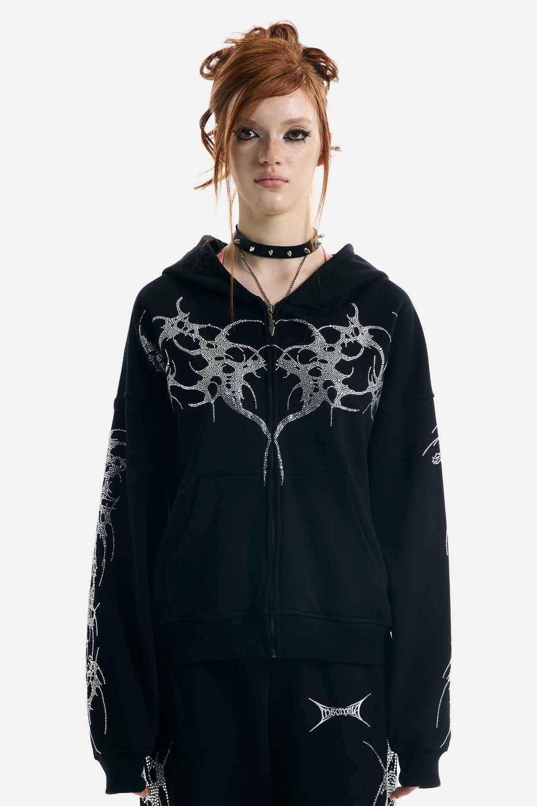Women's black zip-up hoodie with rhinestone wing and thorn graphics