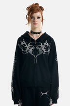 Women's black zip-up hoodie with rhinestone wing and thorn graphics