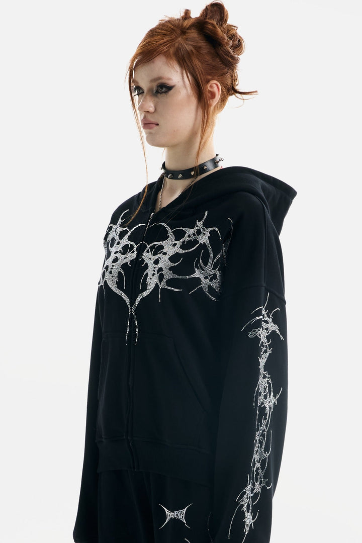 Women's black zip-up hoodie with rhinestone wing and thorn graphics