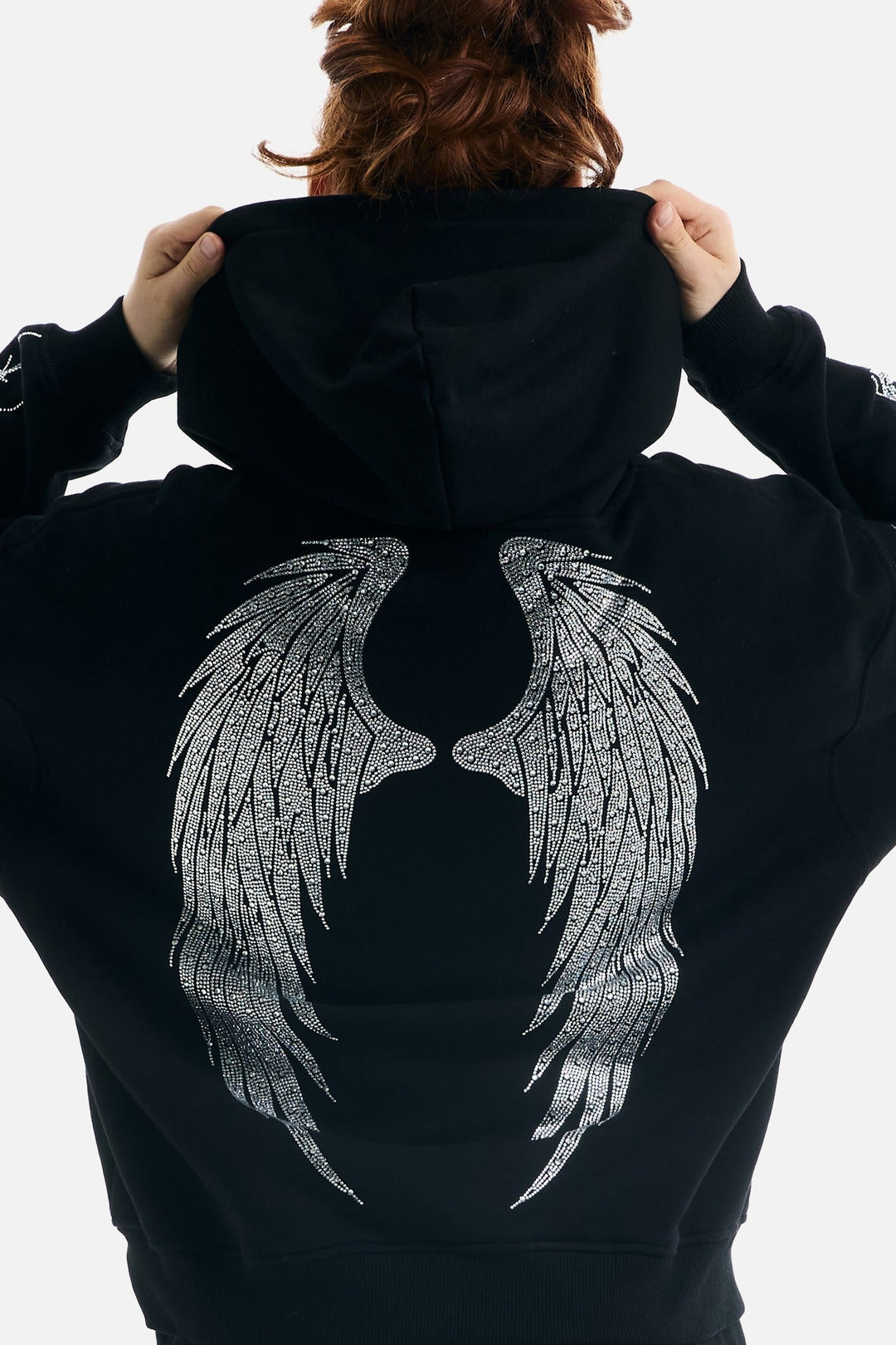 Women's black zip-up hoodie with rhinestone wing and thorn graphics