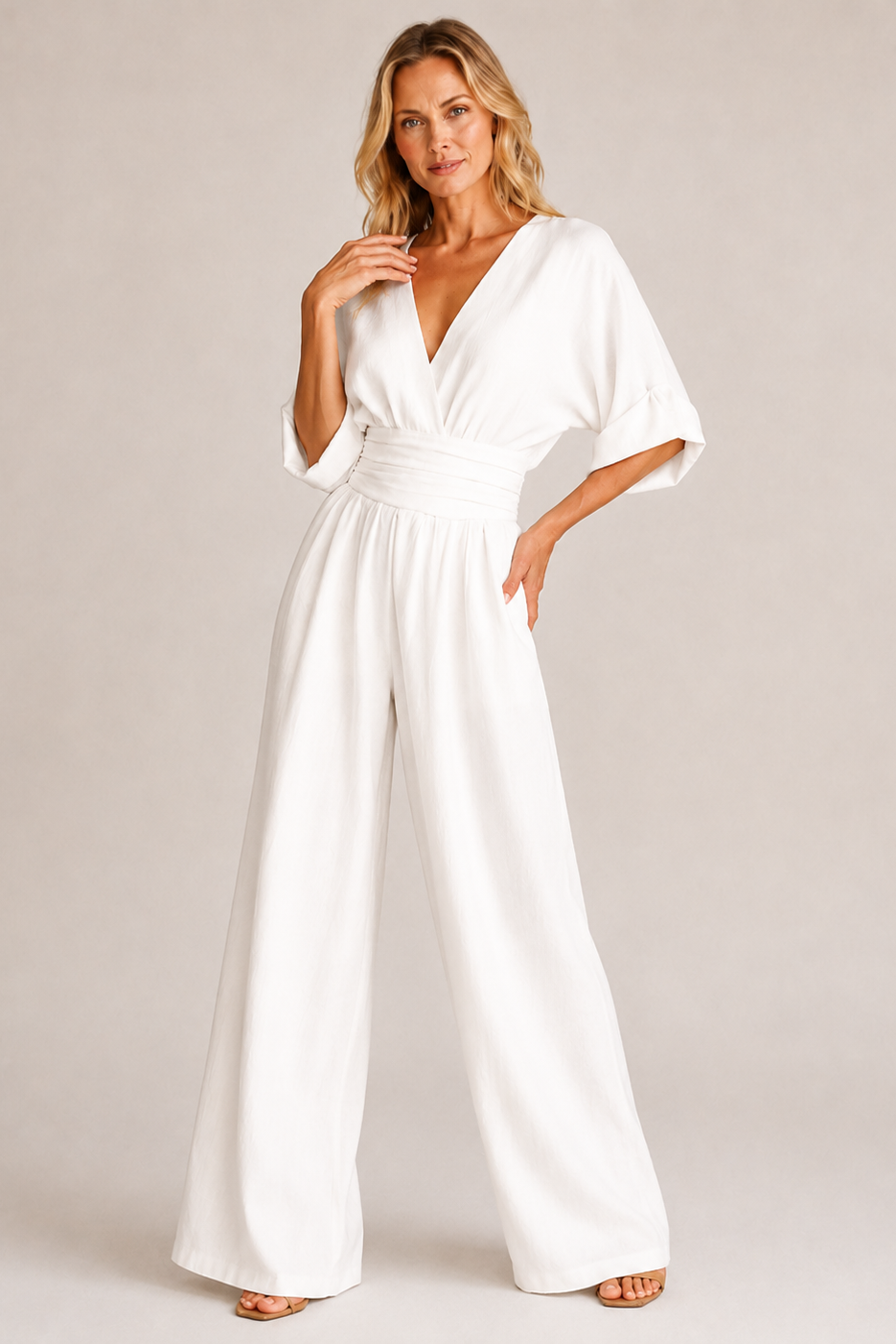 Women's wide-leg jumpsuit with V-neckline, ruched waist, and half sleeves